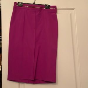 Woman’s skirt just below the knee